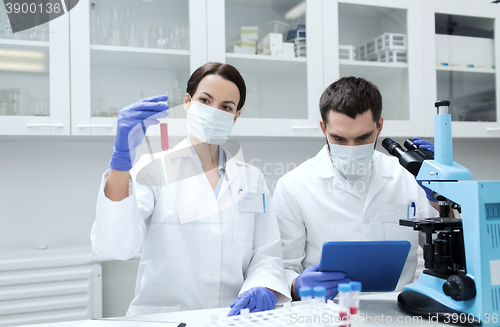 Image of young scientists making test or research in lab