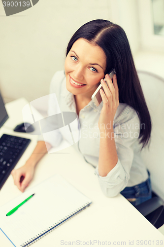 Image of smiling businesswoman or student with smartphone