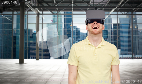 Image of happy man in virtual reality headset or 3d glasses