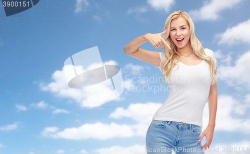 Image of happy young woman or teenage girl in white t-shirt