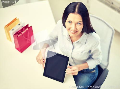Image of close up of woman with tablet pc at office
