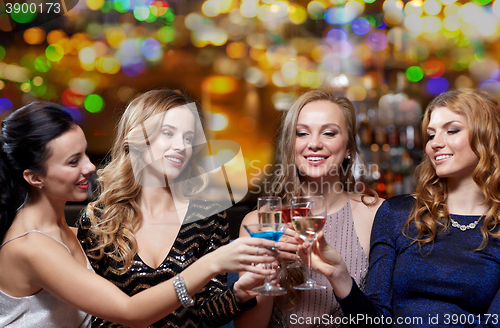 Image of happy women with drinks at night club