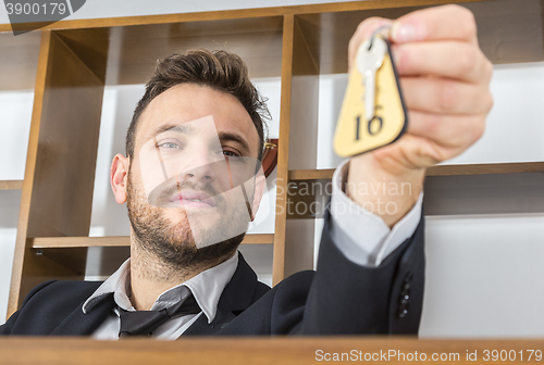 Image of Receptionist Giving the Key