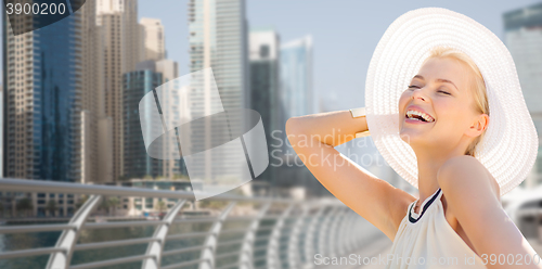 Image of happy woman enjoying summer over dubai city