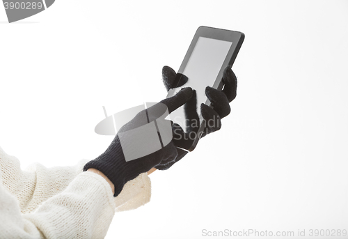 Image of Hands in Gloves Touching the Screen