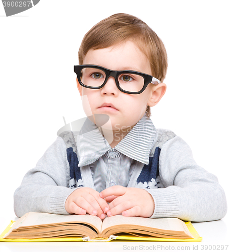 Image of Little child play with book