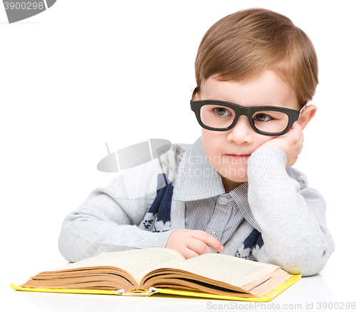 Image of Little child play with book