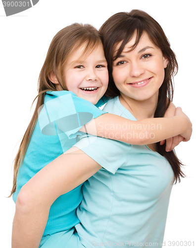 Image of Portrait of a happy mother with her daughter