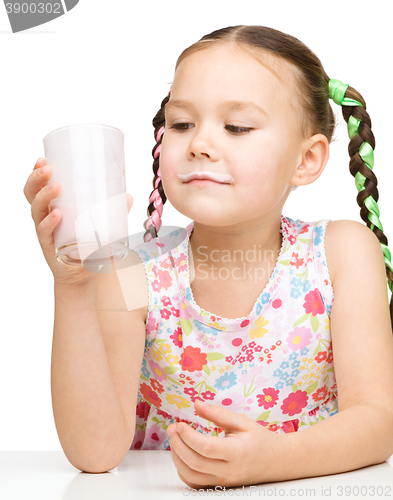 Image of Cute little girl showing milk moustache