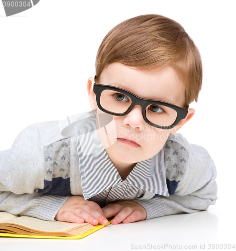 Image of Little child play with book