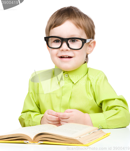 Image of Little child play with book