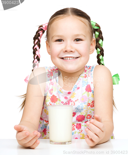 Image of Cute little girl showing milk moustache