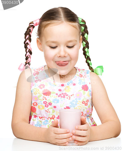 Image of Cute little girl with a glass of milk