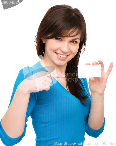 Image of Young woman is holding visit card