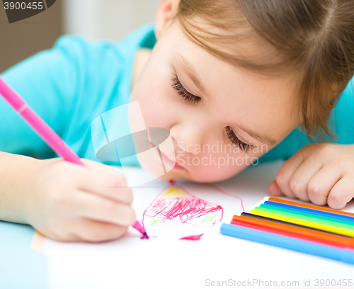 Image of Cute cheerful child drawing using felt-tip pen