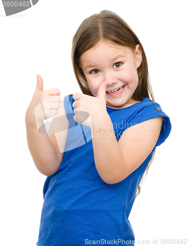 Image of Little girl is showing thumb up gesture