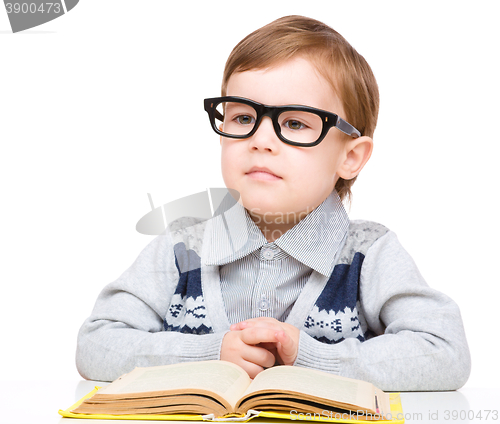 Image of Little child play with book