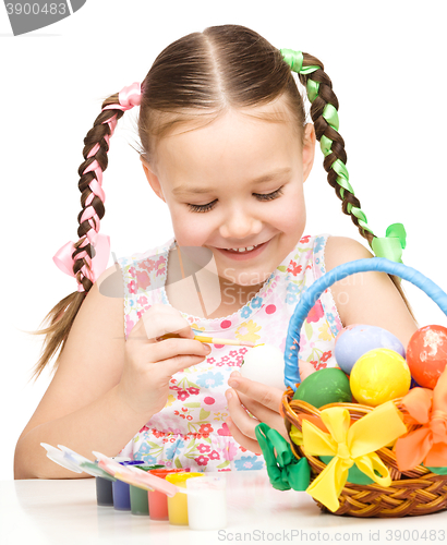 Image of Little girl preparing eggs for Easter