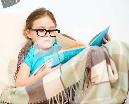 Image of Little girl is reading a book