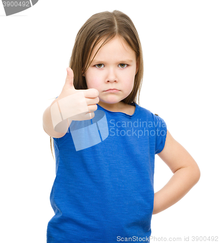 Image of Little girl is showing thumb up gesture