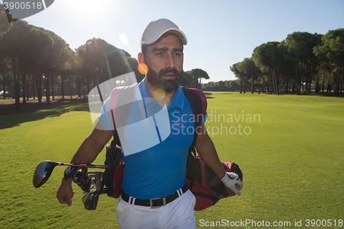 Image of golf player walking