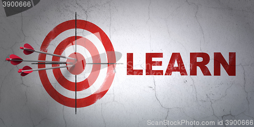 Image of Learning concept: target and Learn on wall background