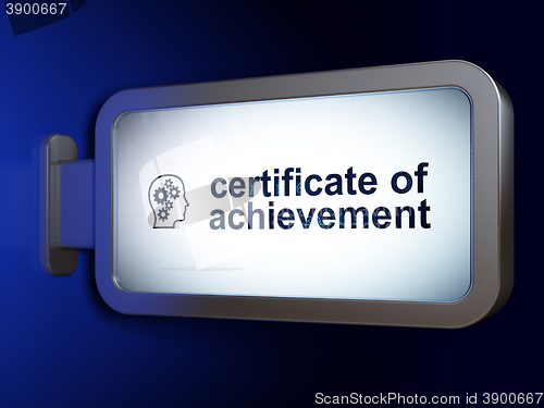 Image of Learning concept: Certificate of Achievement and Head With Gears on billboard background