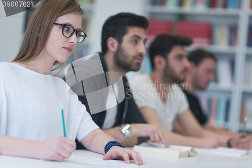 Image of group of students study together in classroom