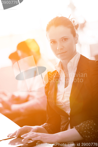 Image of business woman at  office people group on meeting  in background