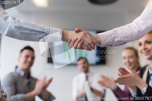 Image of business womans handshake