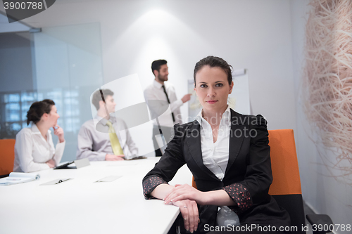 Image of young business woman on meeting  using laptop computer