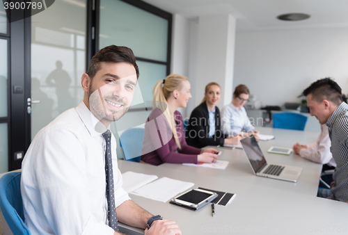 Image of young business people group on team meeting at modern office