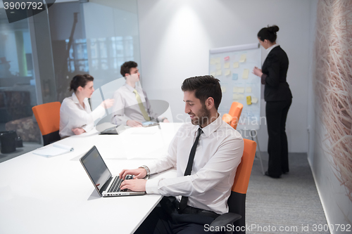 Image of young business man at meeting