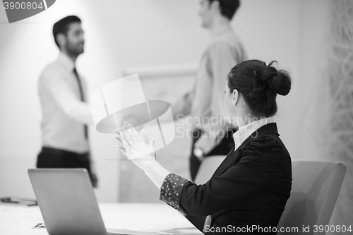 Image of young business woman on meeting  using laptop computer