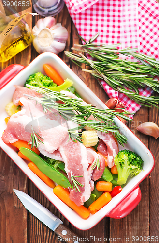 Image of raw meat with vegetables