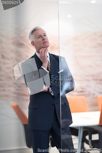 Image of portrait of handsome senior business man at modern office