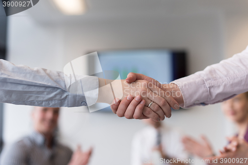 Image of business womans handshake