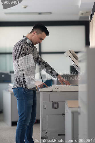 Image of young  business man copy documents