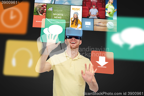 Image of happy man in virtual reality headset or 3d glasses