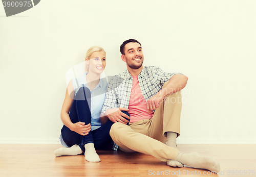 Image of happy couple of man and woman to new home