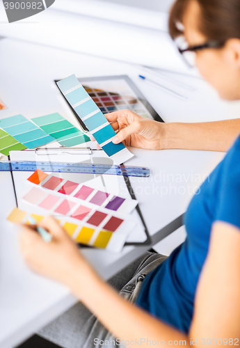 Image of woman working with color samples for selection