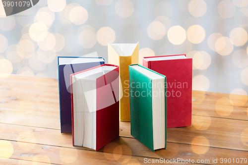 Image of close up of books on wooden table