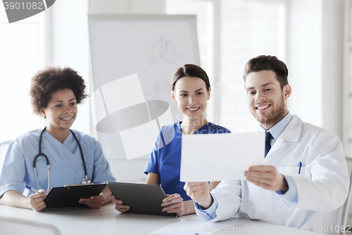 Image of group of happy doctors meeting at hospital office