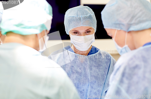 Image of group of surgeons in operating room at hospital