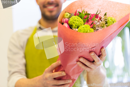 Image of close up of florist with bunch at flower shop