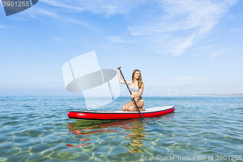 Image of Woman practicing paddle