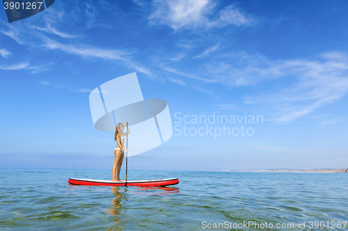 Image of Woman practicing paddle