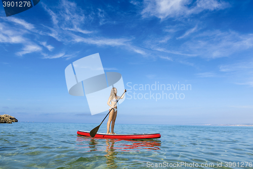 Image of Woman practicing paddle