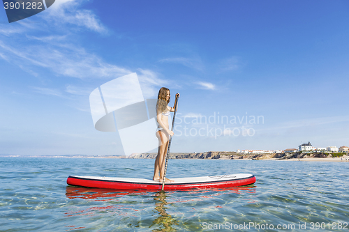 Image of Woman practicing paddle