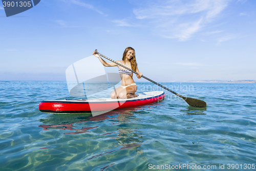 Image of Woman practicing paddle